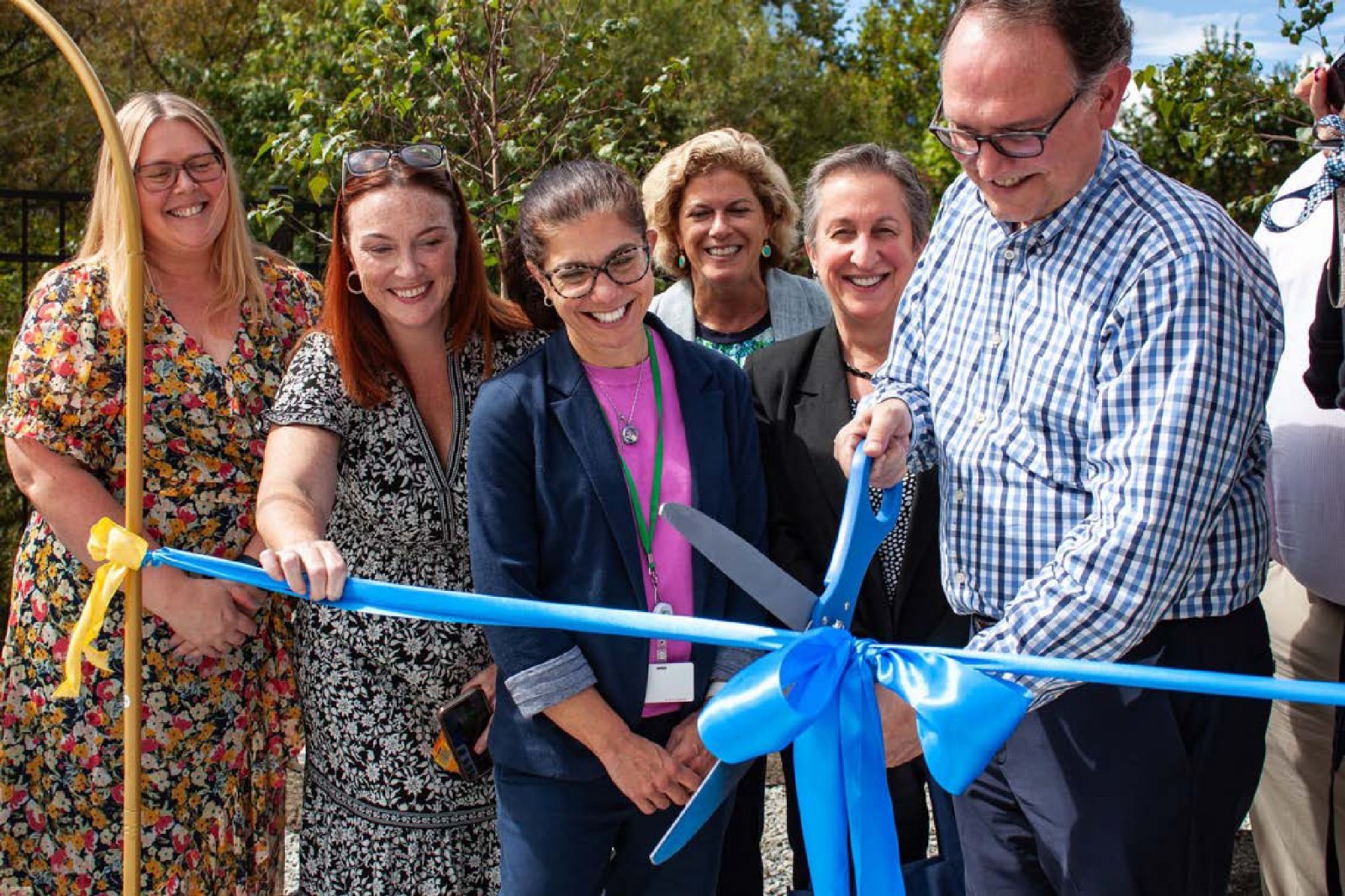 Nonprofit leaders at a ribbon-cutting