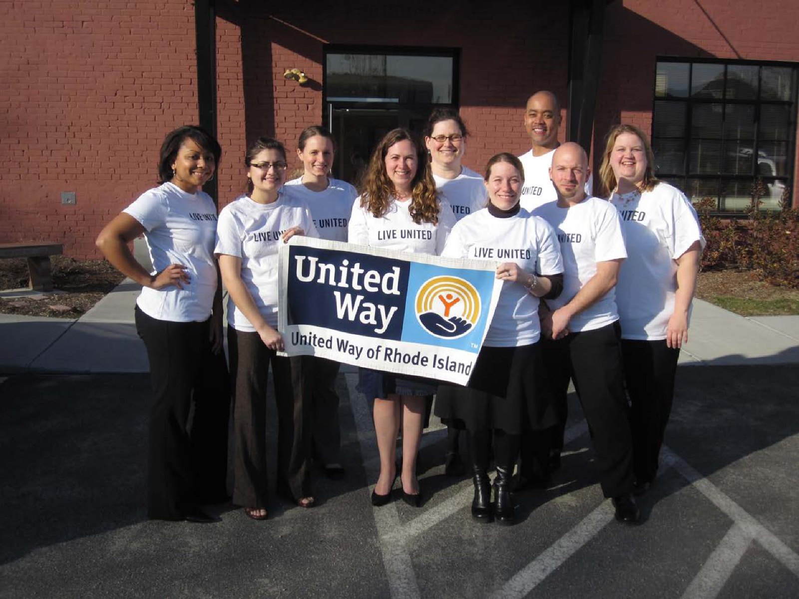 Staff holding a United Way of Rhode Island banner
